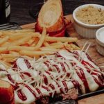 Prato preparado para o festival gastronômico Caraguá A Gosto 2026 em restaurante participante de Caraguatatuba